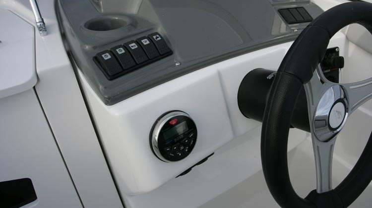 Marine grade electrical switches, compass, media/receiver, USB and 12V sockets and Karnic sport steering wheel