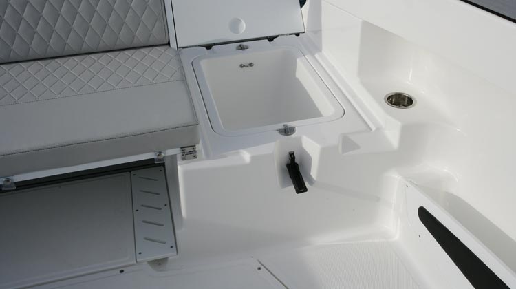 Stern, under seat wells (2) removable for extra storage and access to bilge
